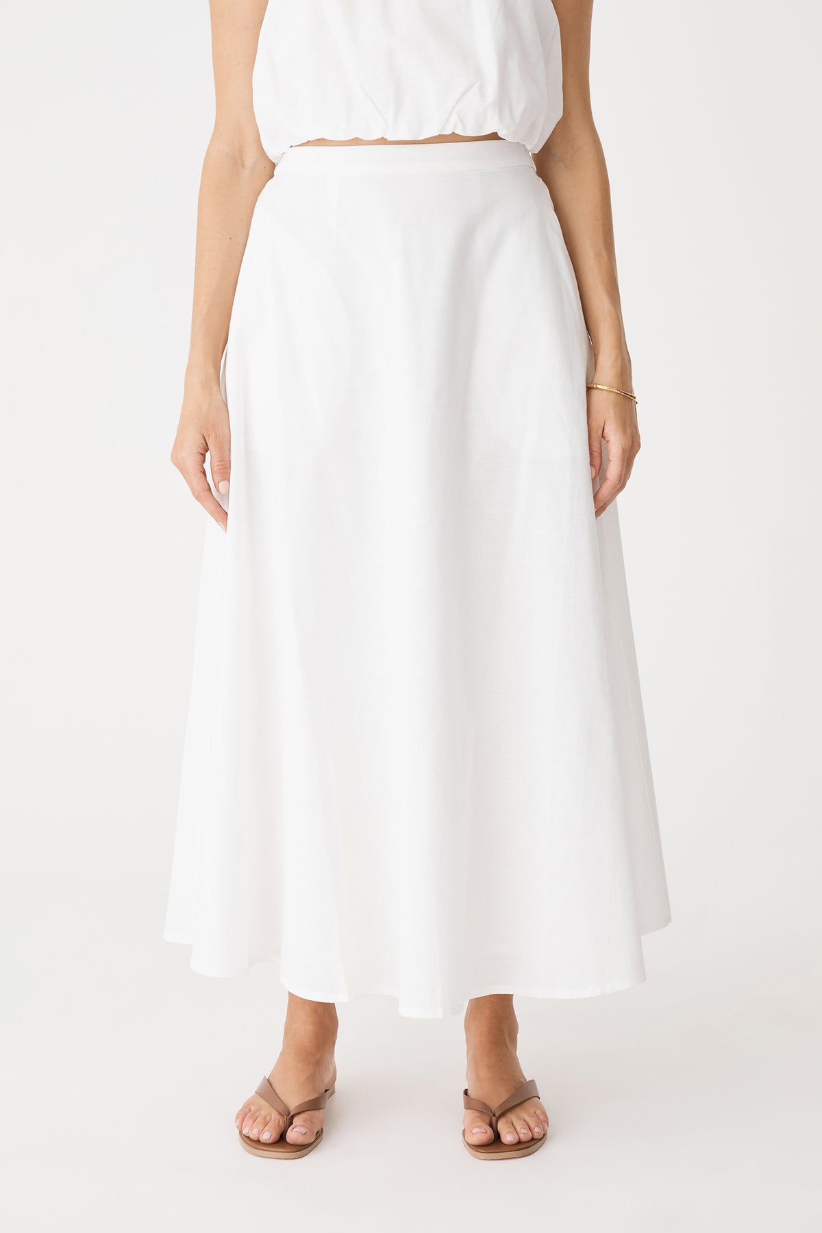 Front close view of the ivory A-line midi skirt from waist to hem
