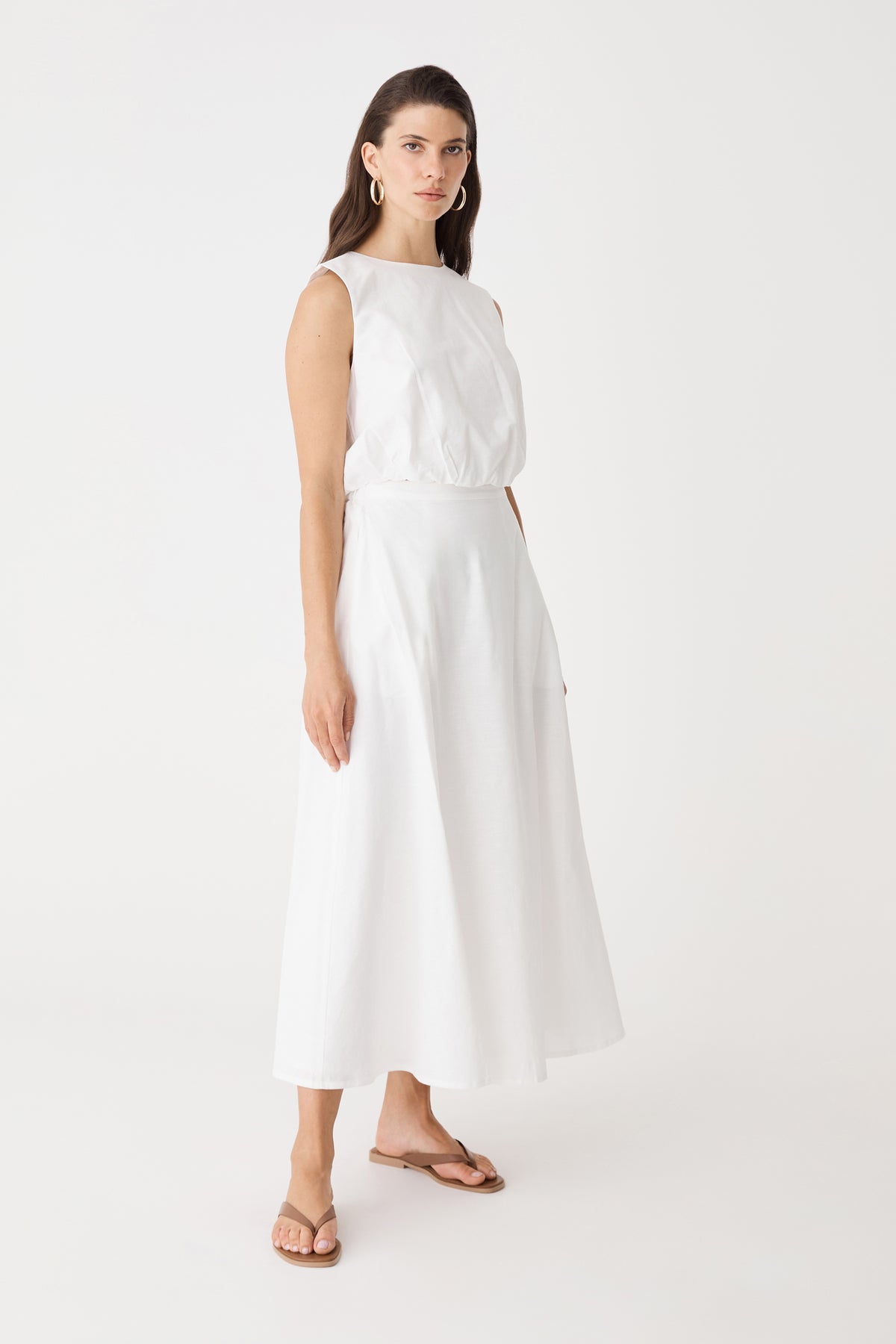 Side view of the ivory Kenya Linen Skirt showing the A-line shape