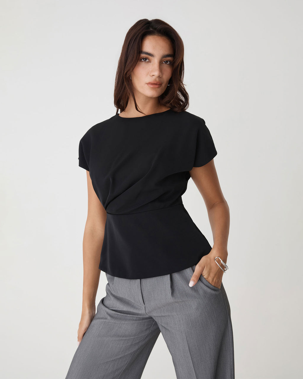 Bonnie Gathered Peplum Top in black — close-up view