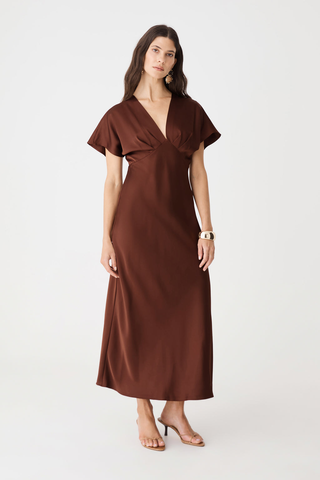 Front view showing bias-cut midi skirt of the brick satin dress