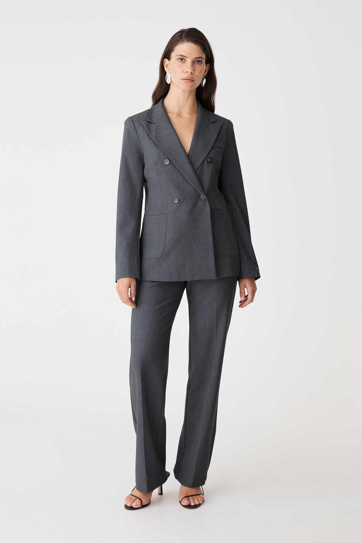 Merid Double Breasted Blazer in dark grey, front view worn with matching tailored pants