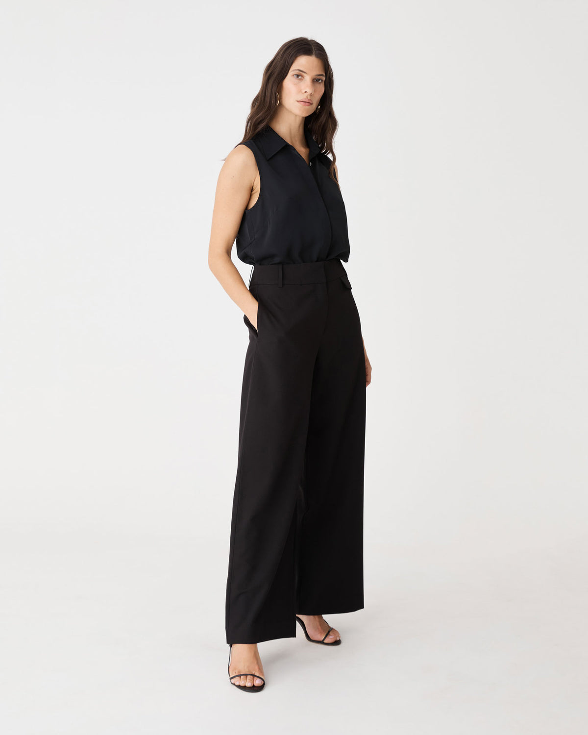 Side view of the black Milton Wide Leg Pants with hand in side pocket