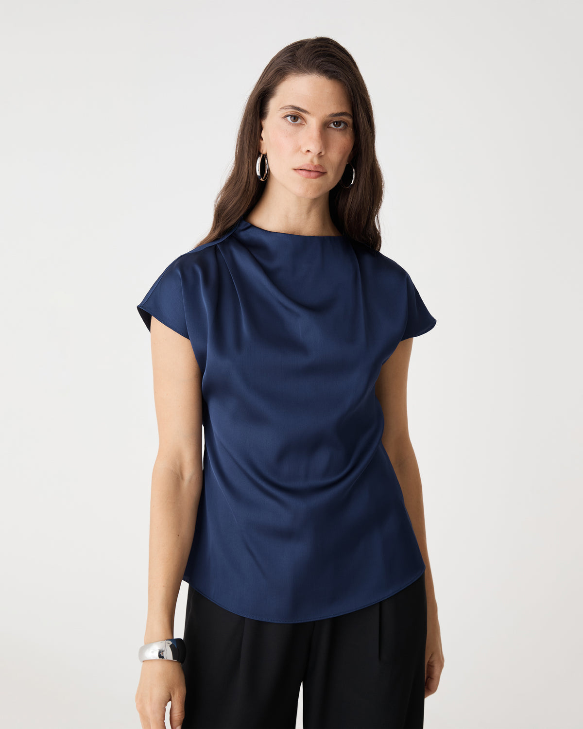 Front close view of the navy Zafina Pleated Draped Top showing draped neckline and cap sleeves