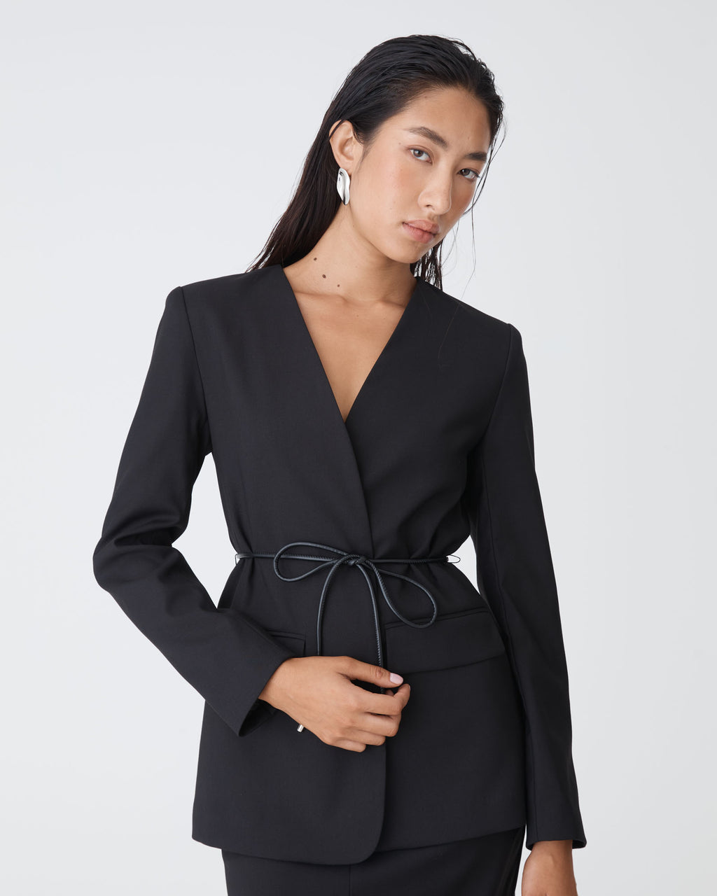 Aaria Collarless Blazer in black — close-up view