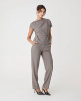 Loretta Pleat Belted Top in latte check — full-length view