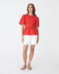Jade Linen Peplum Top in red — full-length view