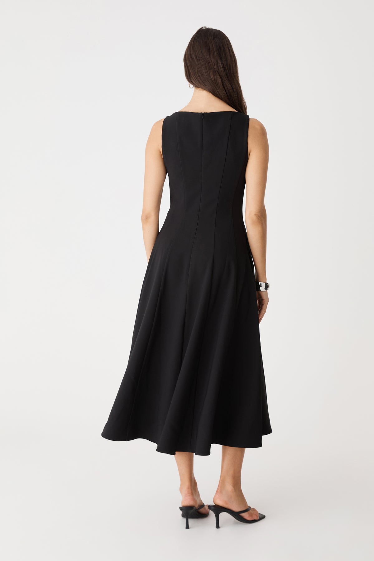 Back view showing invisible zipper and flared midi skirt
