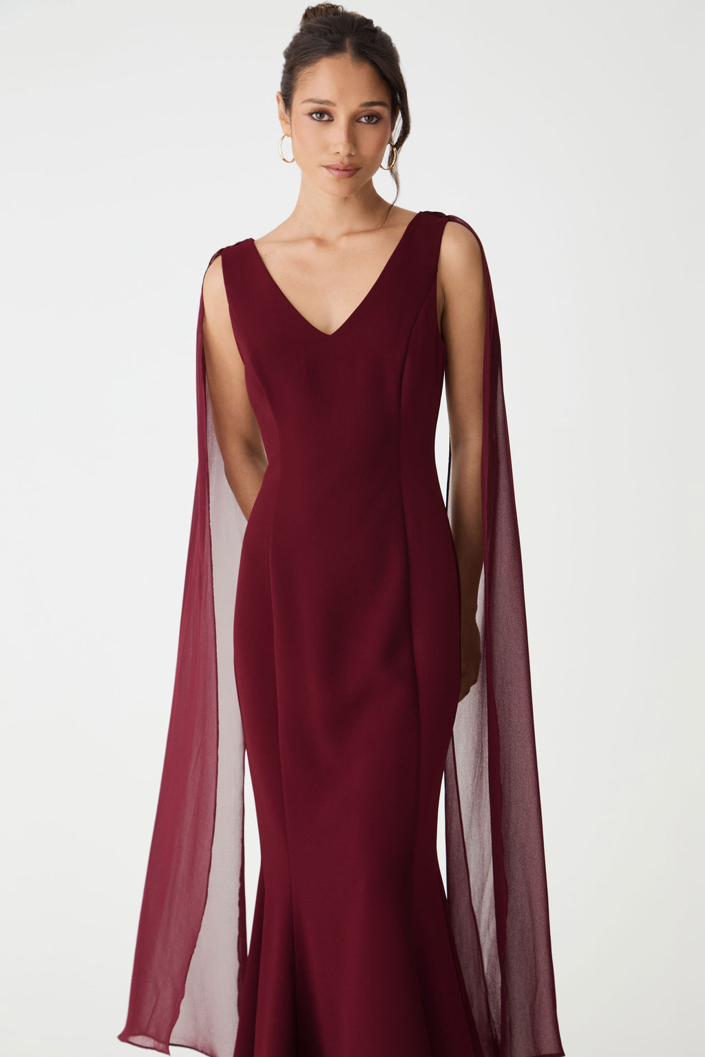 Front view from the waist up, showing the fitted bodice and draping scarves