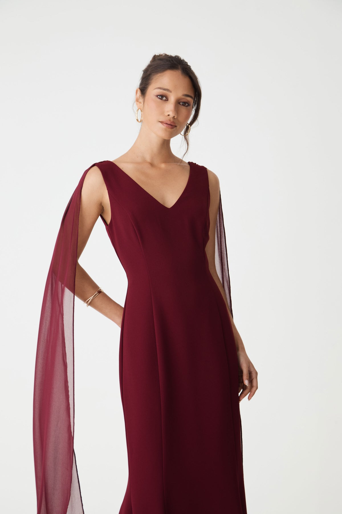 Close-up of the sheer chiffon shoulder scarf falling from the shoulder