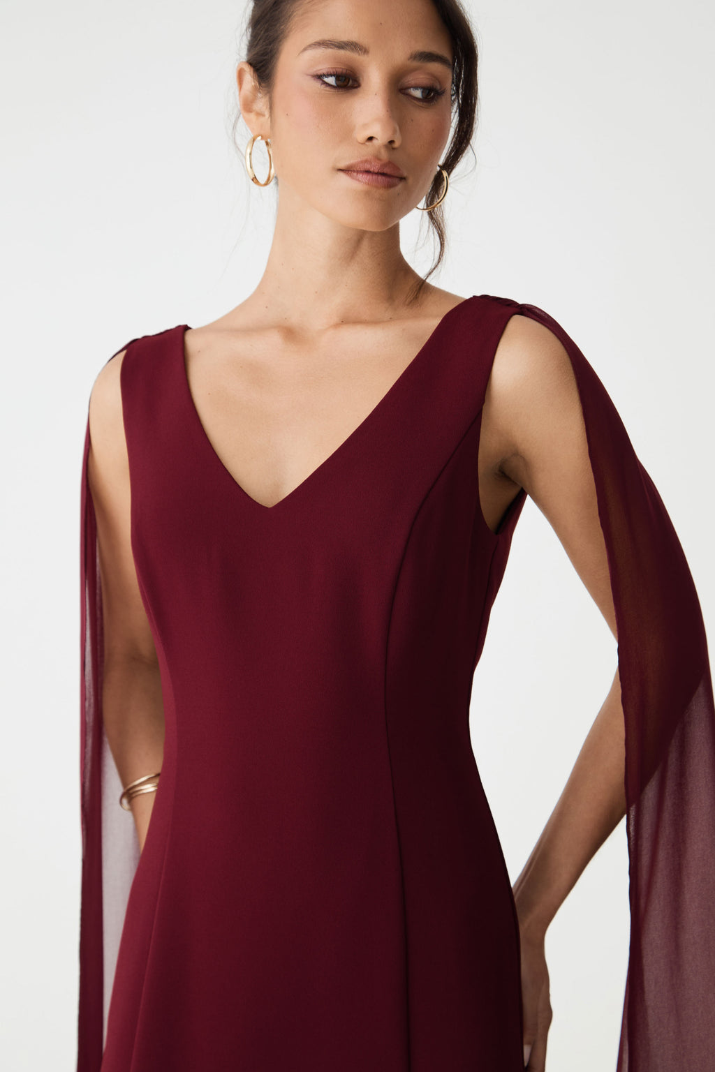Close-up of the V-neckline and seamed bodice in shiraz