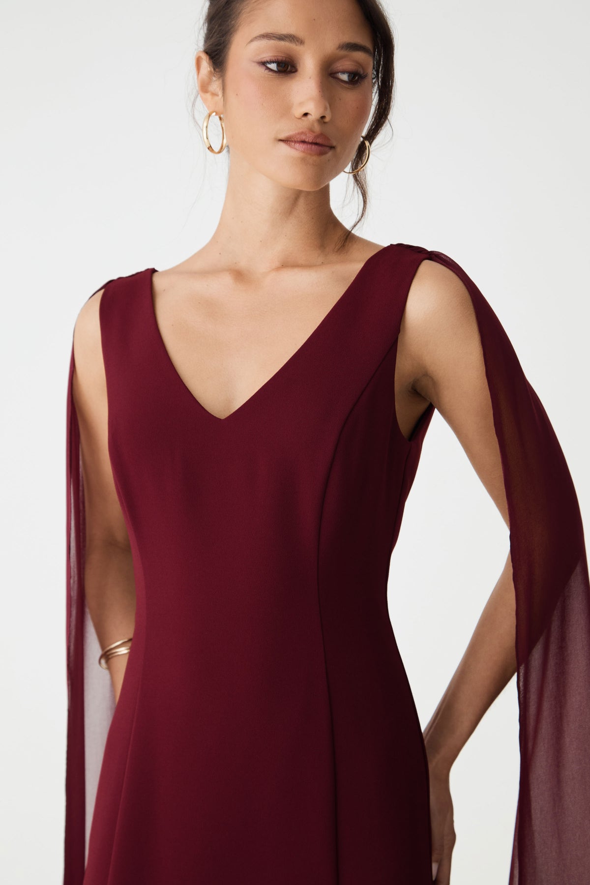 Close-up of the V-neckline and seamed bodice in shiraz