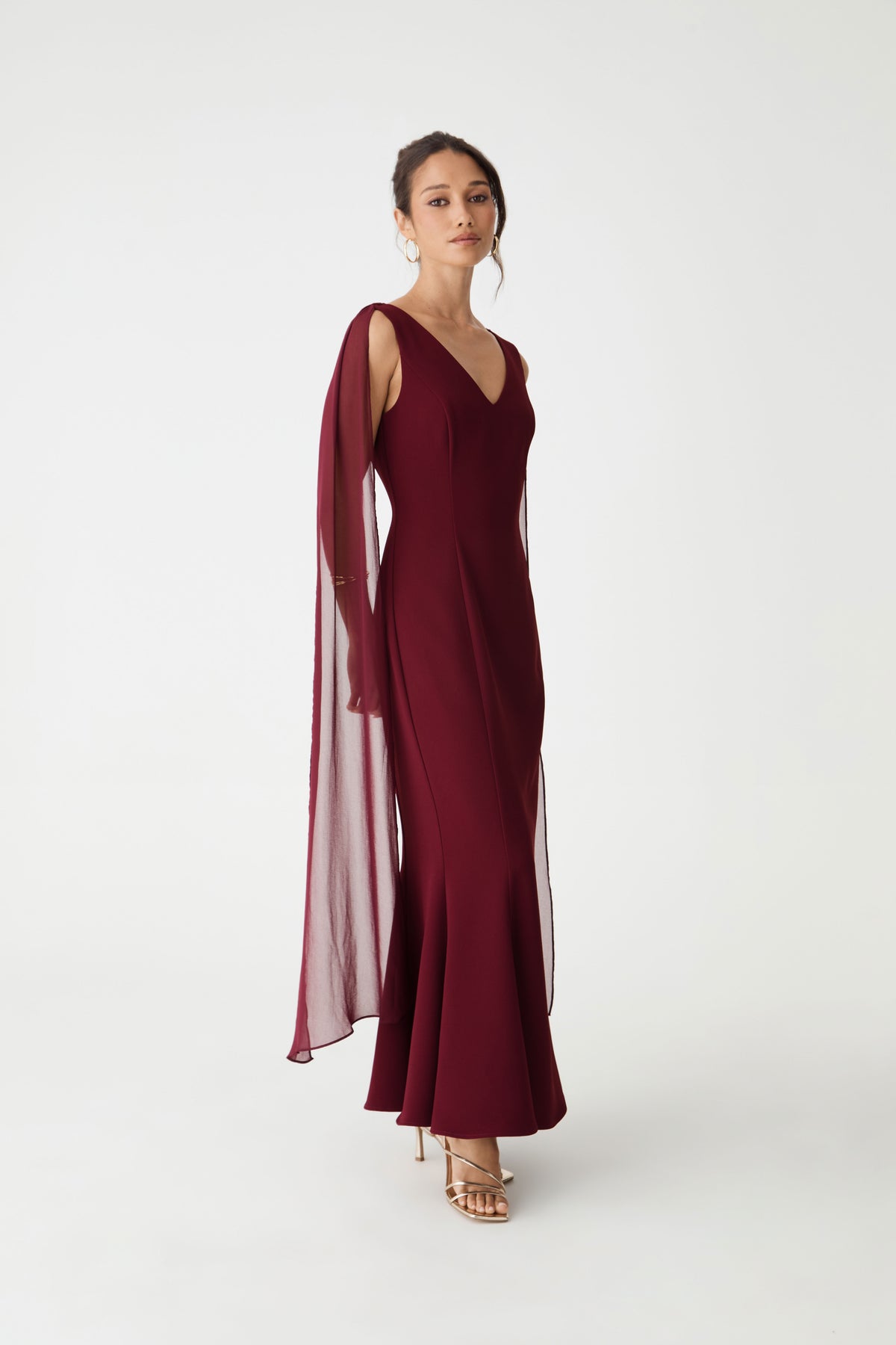 Side view showing the mermaid silhouette flaring toward the hem