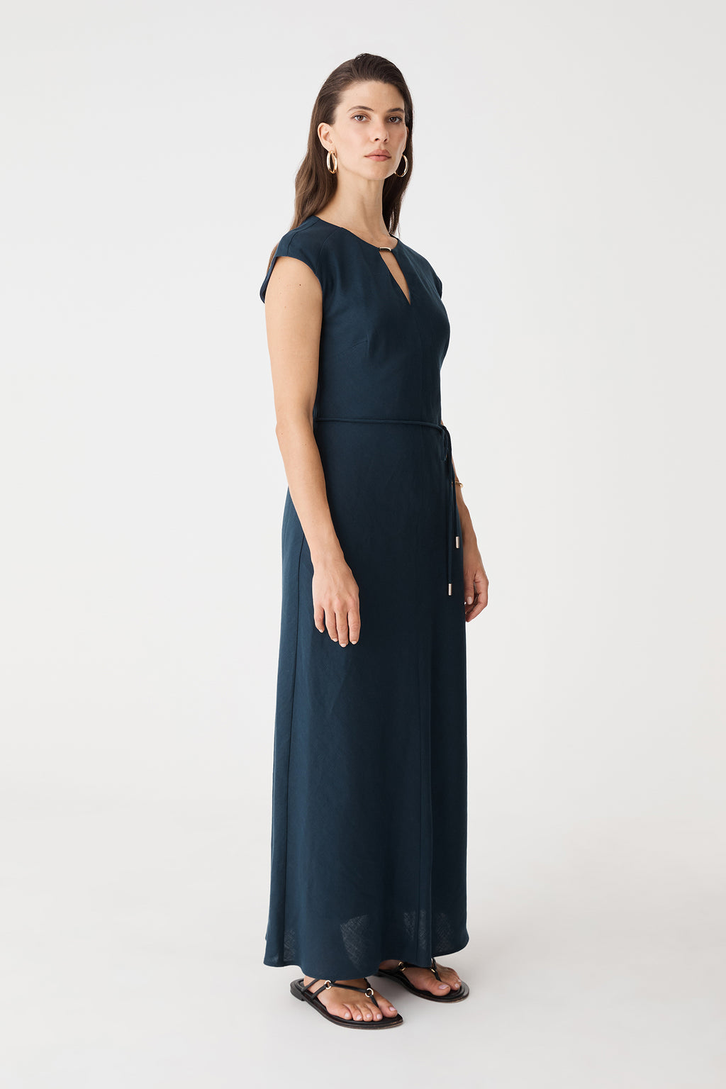 Side view of the navy maxi dress showing the flared skirt