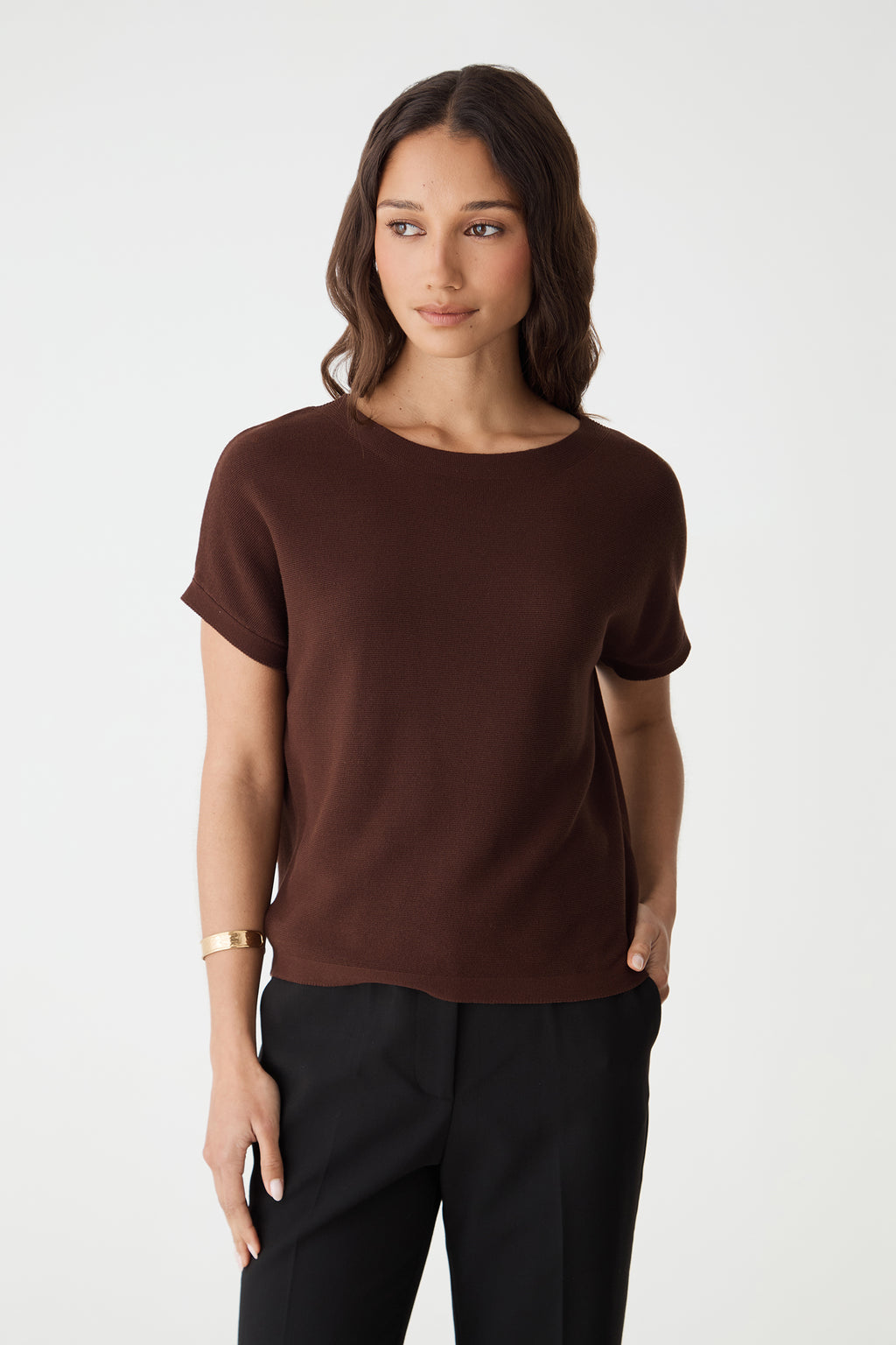 Close front view of the Fudge knit top showing boat neckline and folded cap sleeve cuffs