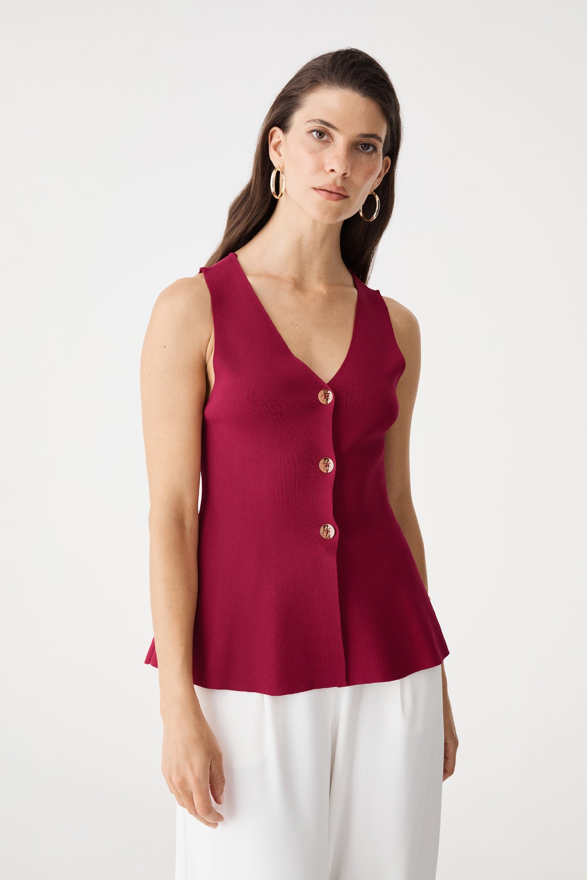 Valerie Button Peplum Knit Top in fuchsia, front view with V-neck and gold-tone buttons