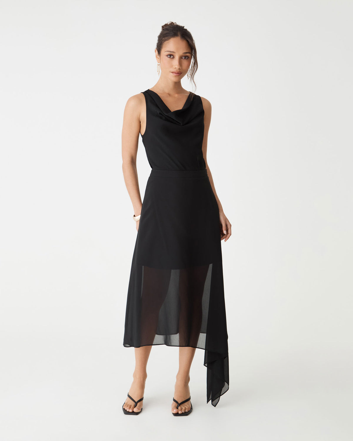Desiree Asymmetric Skirt in black, front view with sheer chiffon hem and black sleeveless top