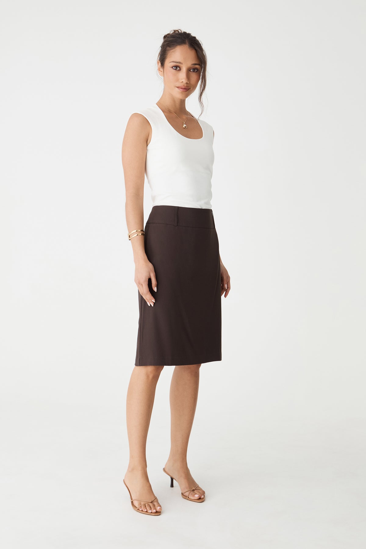 Veronica Straight Crepe Skirt in chocolate, side-angle view worn with a white sleeveless top