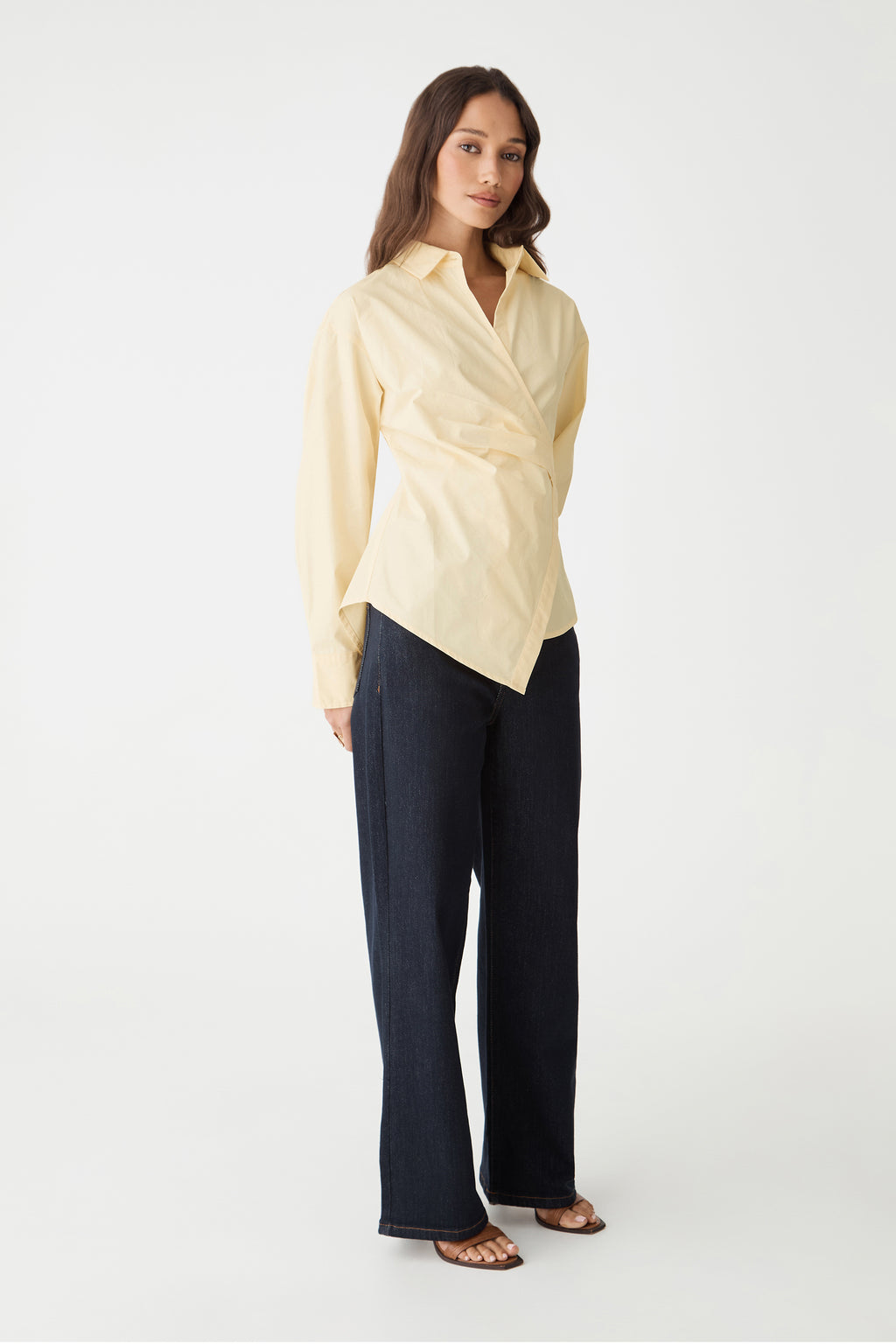 Side view of the Katrina Wrap Shirt in Limoncello with navy trousers