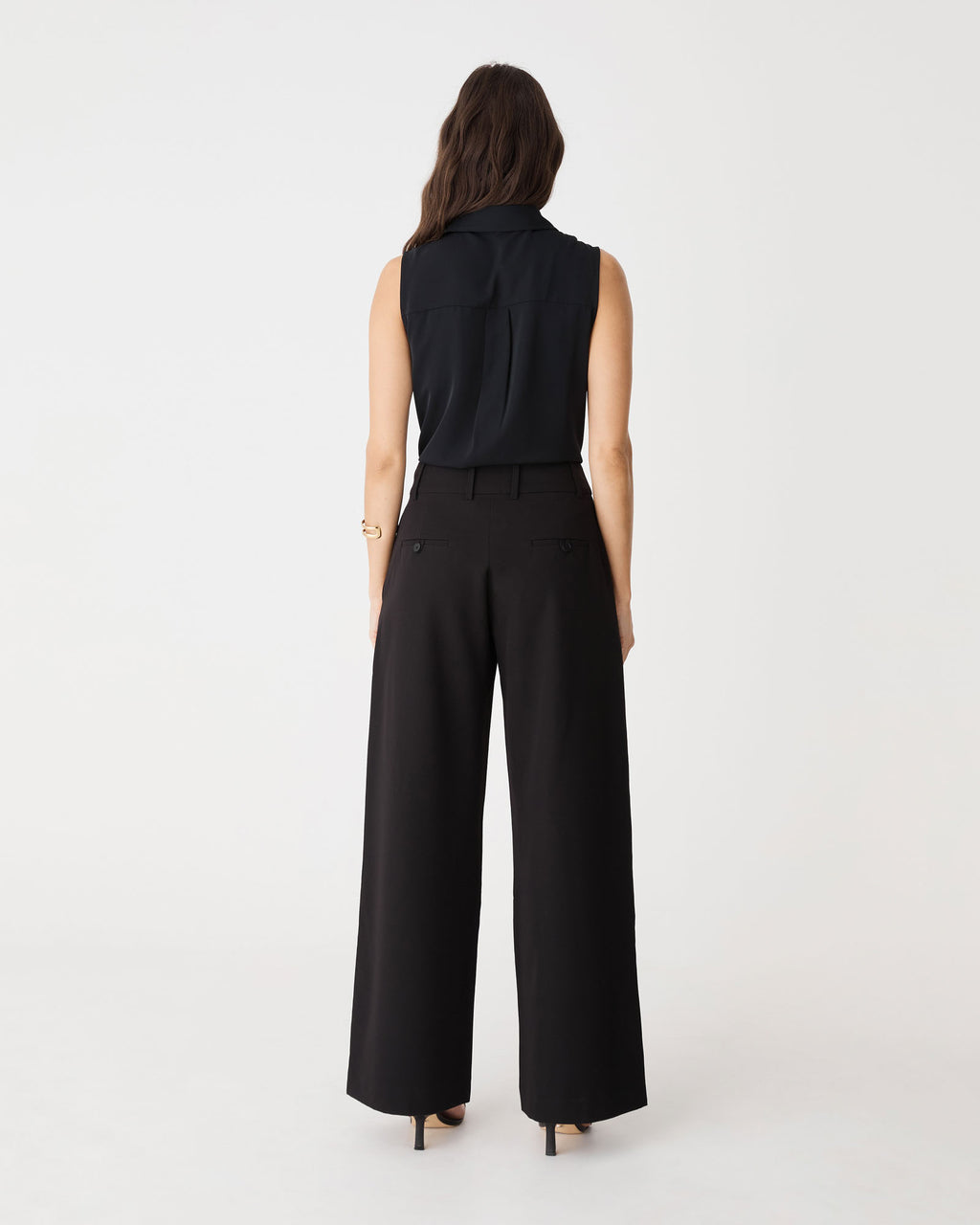 Back view of the black Brooklyn Sleeveless Shirt showing yoke and box pleat