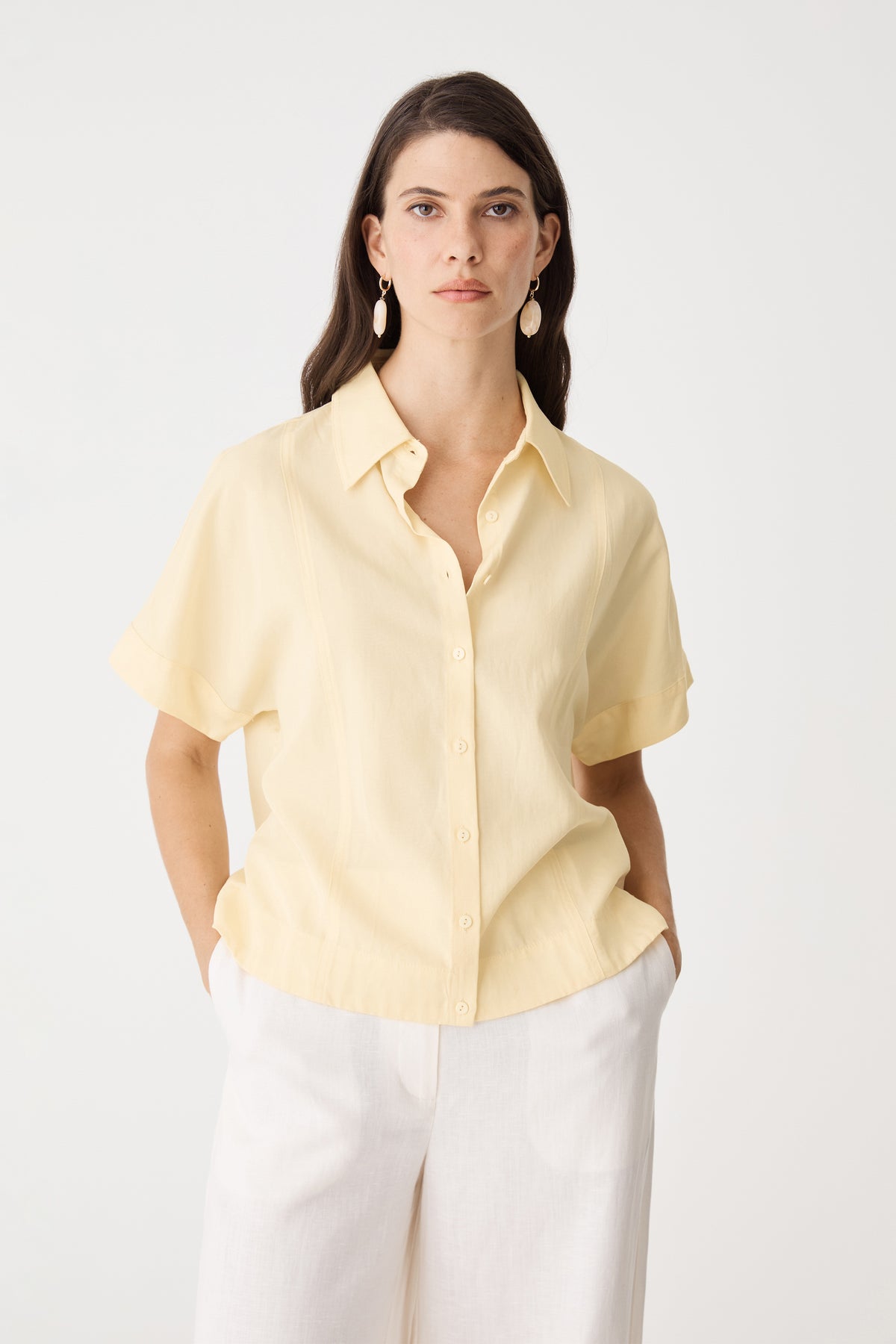 Heather Lyocell Shirt in Limoncello, front view with pointed collar, worn with white wide-leg trousers