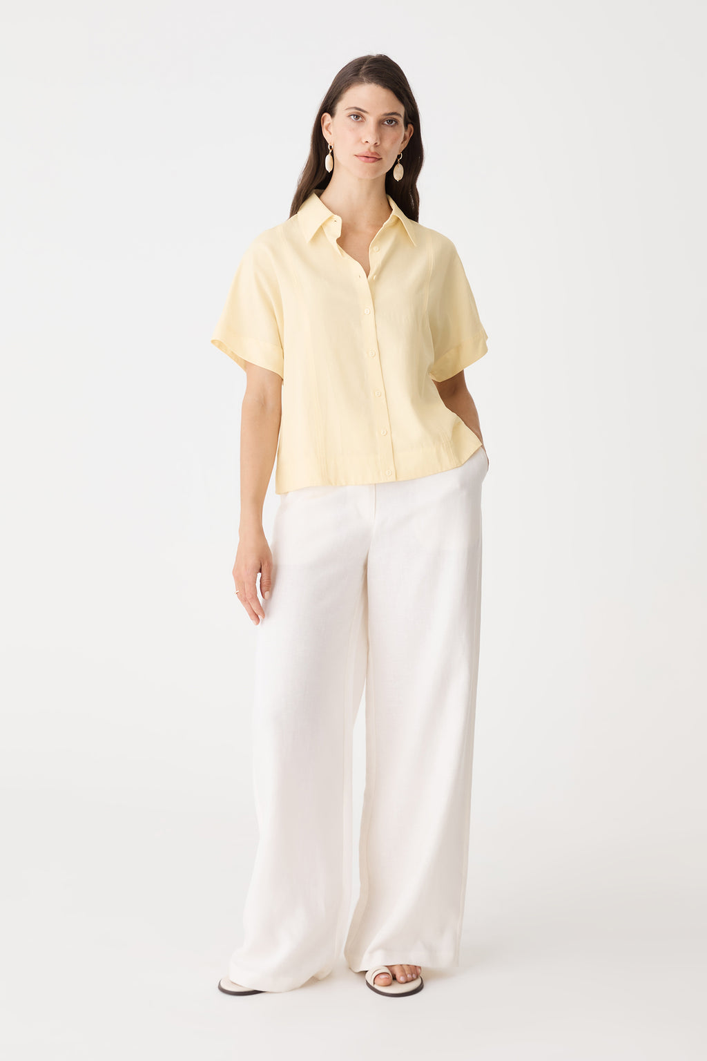 Heather Lyocell Shirt in pale yellow, front view worn open-collared with white wide-leg trousers
