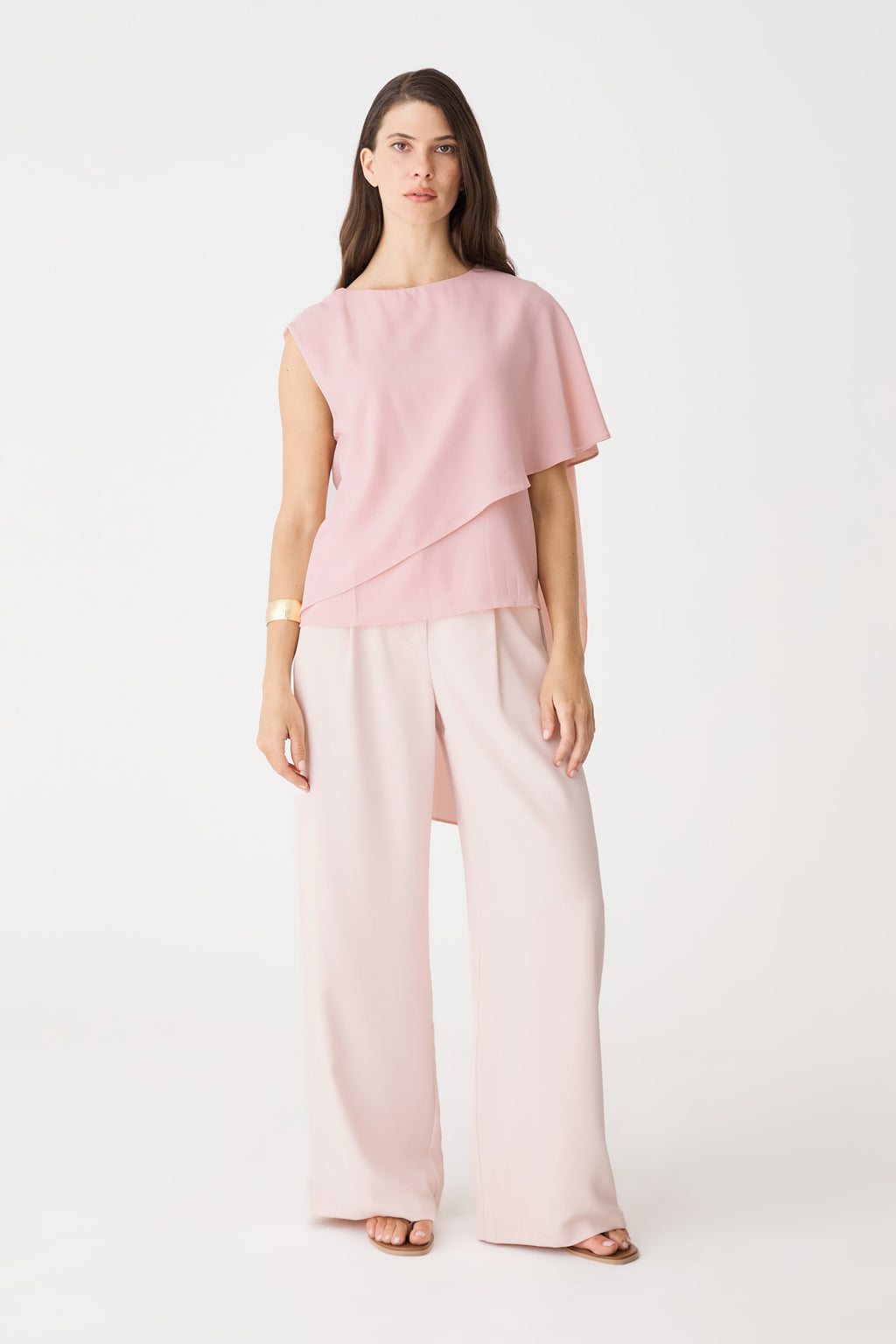 Cecilia Asymmetric Top in dusty pink, front view with cape overlay, worn with pale pink wide-leg trousers