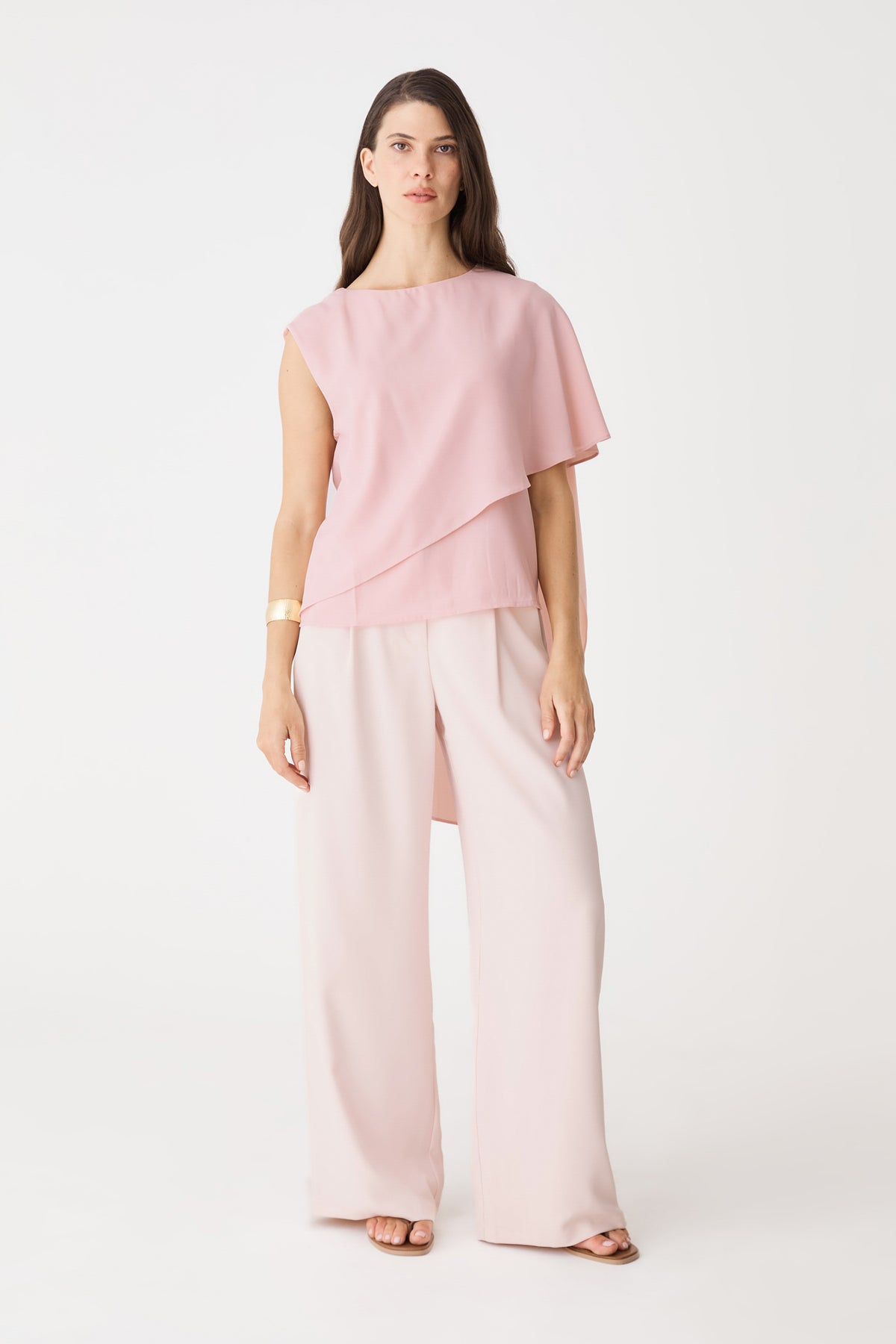 Cecilia Asymmetric Top in dusty pink, front view with cape overlay, worn with pale pink wide-leg trousers