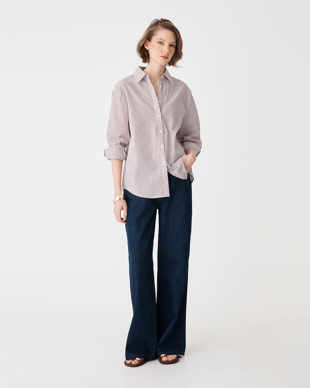Samara 2 Cotton Striped Shirt in brown stripe, front view worn with navy wide-leg trousers