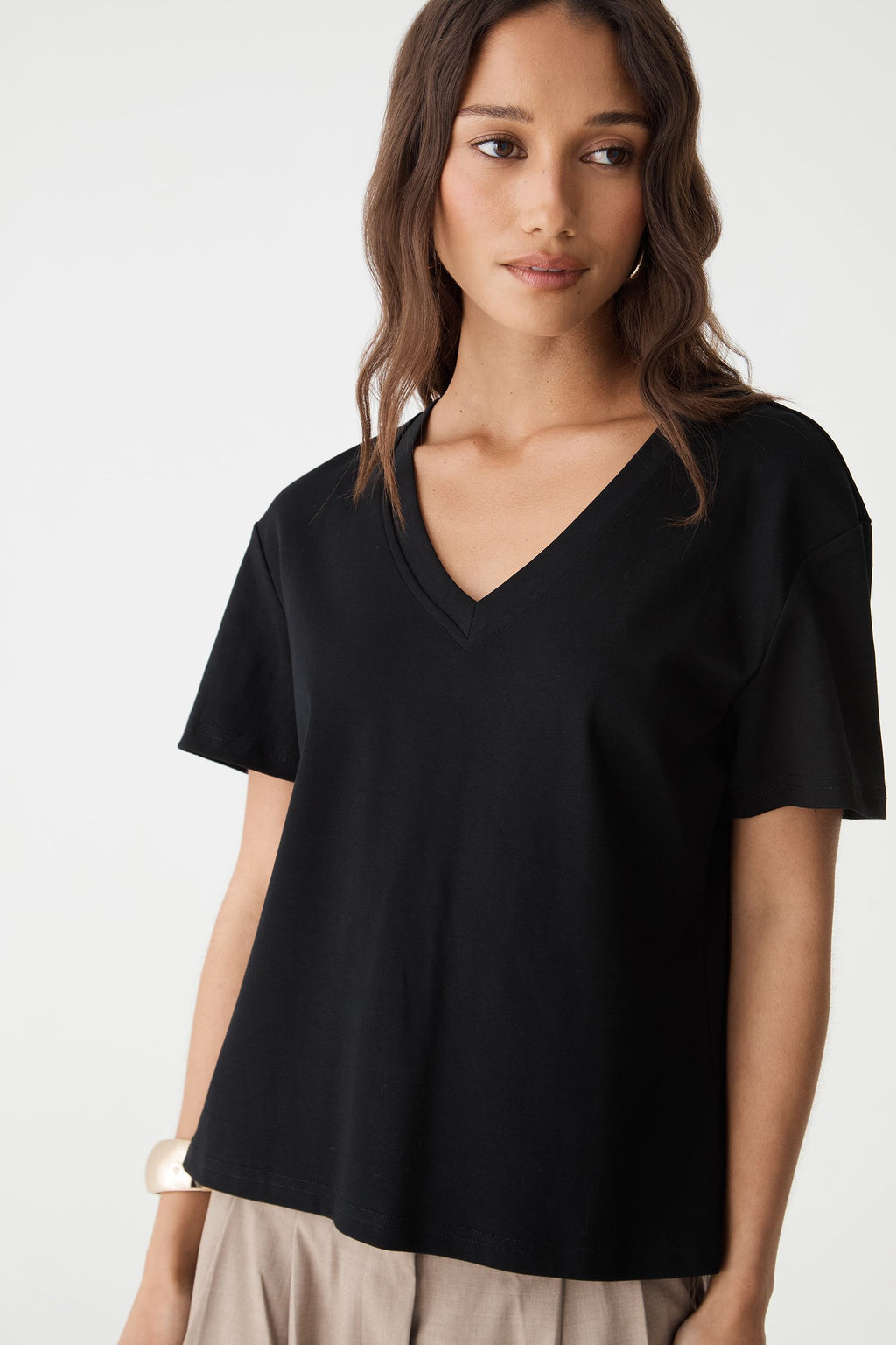 Close-up front view of the black May V-Neck Cotton T-Shirt showing the V-neckline and short sleeves
