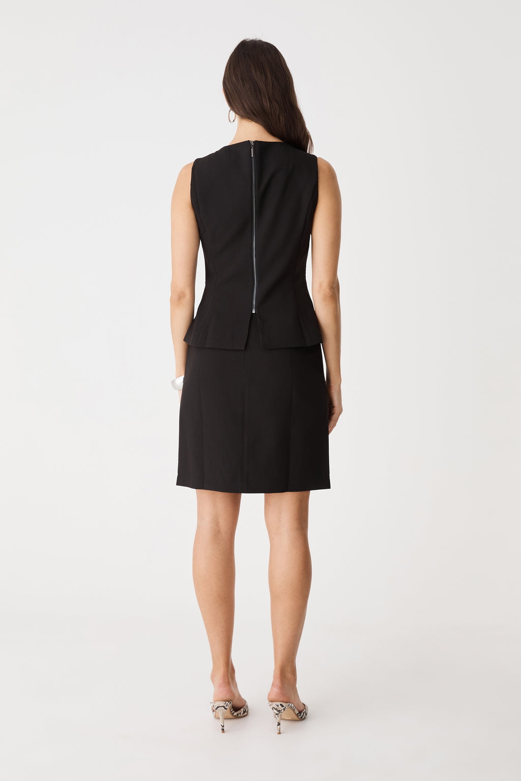 Back view showing the exposed full-length back zip of the black Melanie 2 Tailored Top
