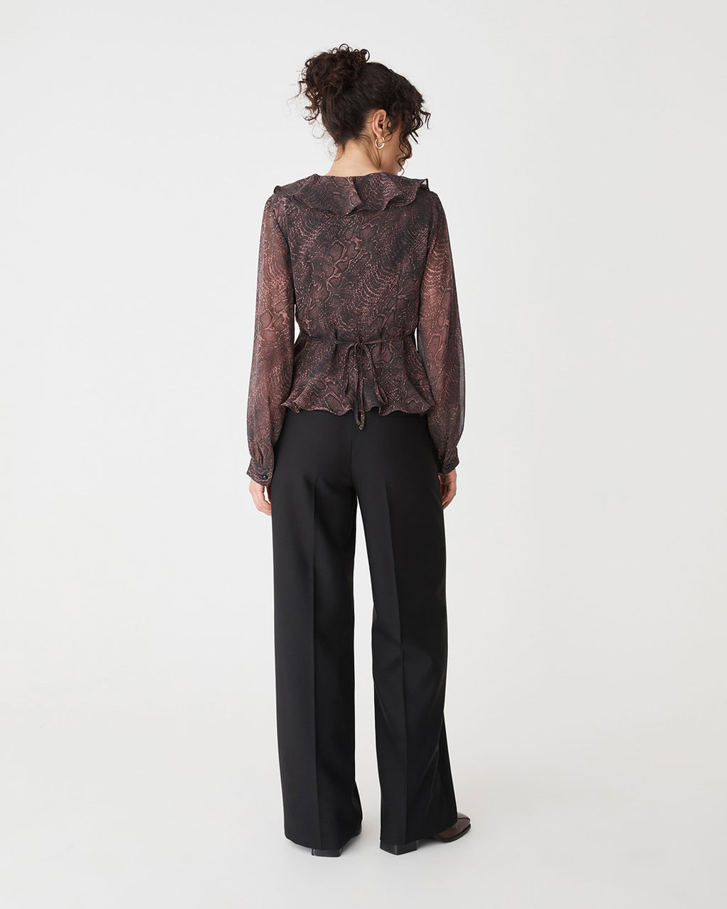 Sonia V-Neck Ruffle Top in brown snake — back view
