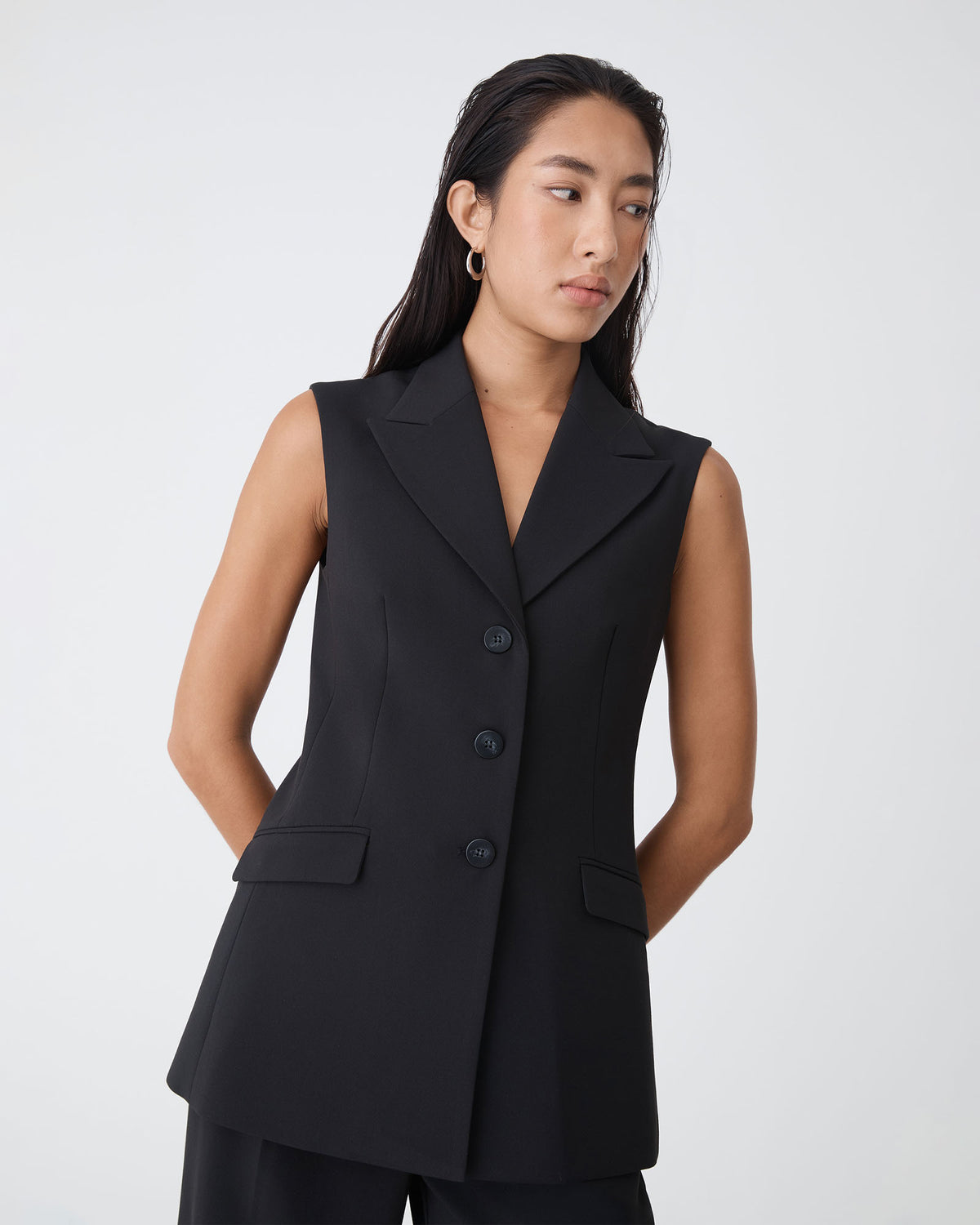 Nikki Long Collared Vest in black — close-up view