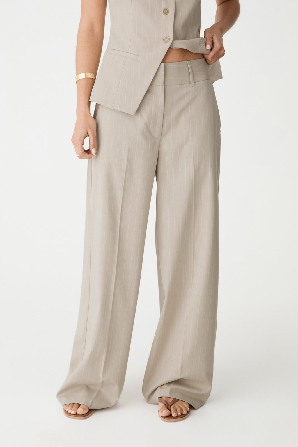 Zoe Pinstripe Wide Leg Pants in beige pinstripe, front view cropped at waist, worn with matching vest