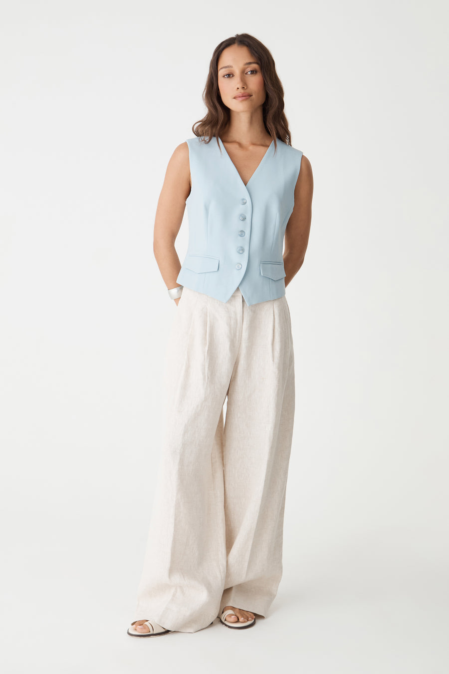 Melanie Tailored Vest in sky blue, front view worn with cream wide-leg trousers