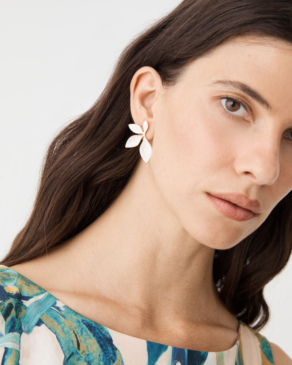 Martina Petal Earrings in ivory with gold-tone edging, worn, front view of face and ear